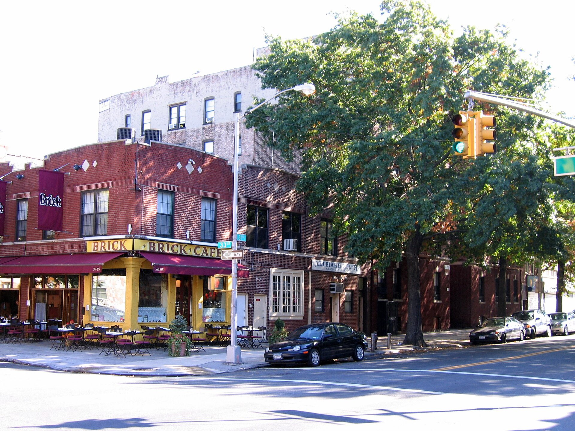 Cafe tables on the corner of 31st Avenue and 33rd Street in Astoria, Queens